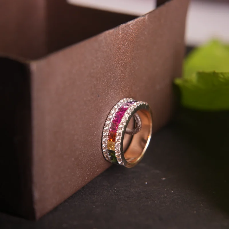 Luxurious Gold Diamond Ring with Vibrant Gemstone Accents