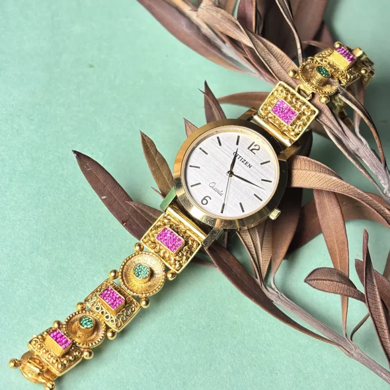 Elegant Silver Watch with Gold-Tone Detailing & Traditional Bracelet Design
