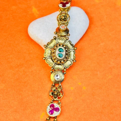 Antique-Inspired Silver Bracelet with Floral Design and Gemstone Detailing