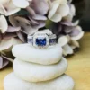 925 Sterling Silver Royal Blue Sapphire Halo Ring with Baguette CZ Detailing